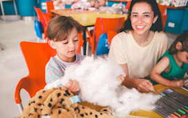 A tot and older child enjoy getting creative in a Make a Bear session at Haven.