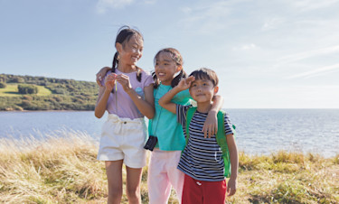 Kids playing freely at the coast at Littlesea
