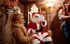 Children meet Santa inside his Grotto on one of Haven's parks.