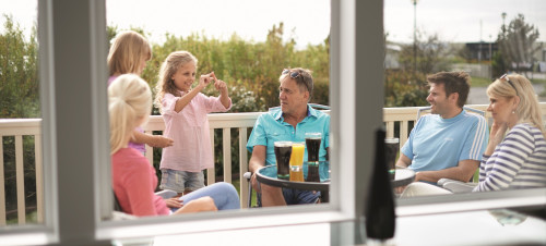 Owner's family relaxing on their decking