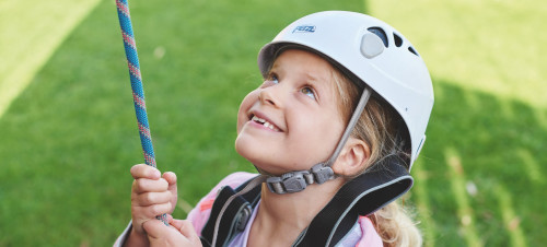 Helmet and ropes at the ready before you take to the climbing wall