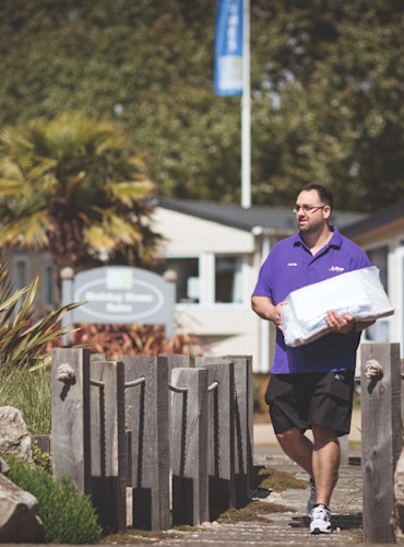 Housekeeping delivering towels and linen