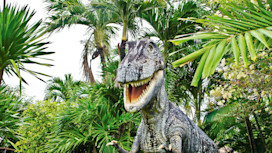 Dinosaur hides in the foliage in the park