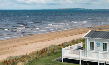 Representation of the view and the wraparound deck in a Signature Gold caravan at Craig Tara