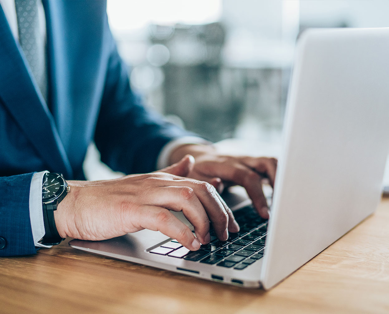 Person type on a laptop computer