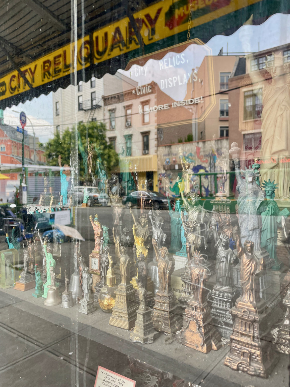 Window filled with Statue of Liberty figurines at City Reliquary