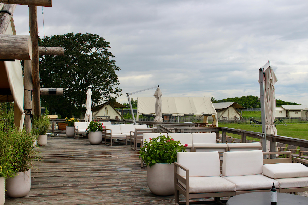 Outdoors lounge space at Collective Retreats on Governors Island