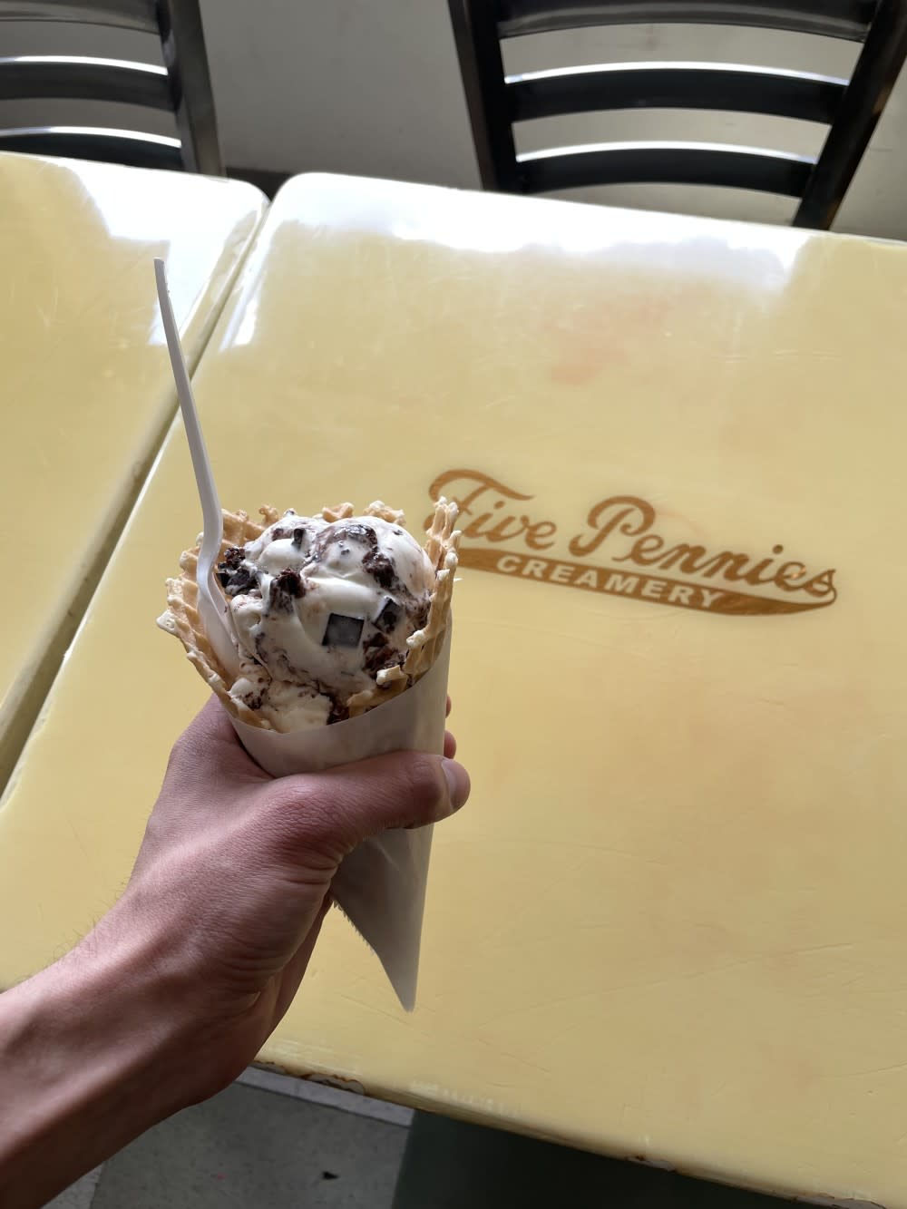 A cone filled to the top with ice cream from Five Pennies in Rockville Centre
