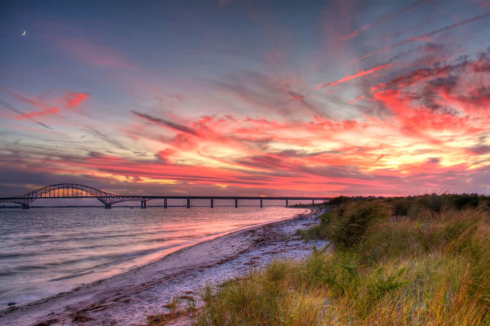 Fire Island Inlet Bridge at sunset from the shores of Robert Moses