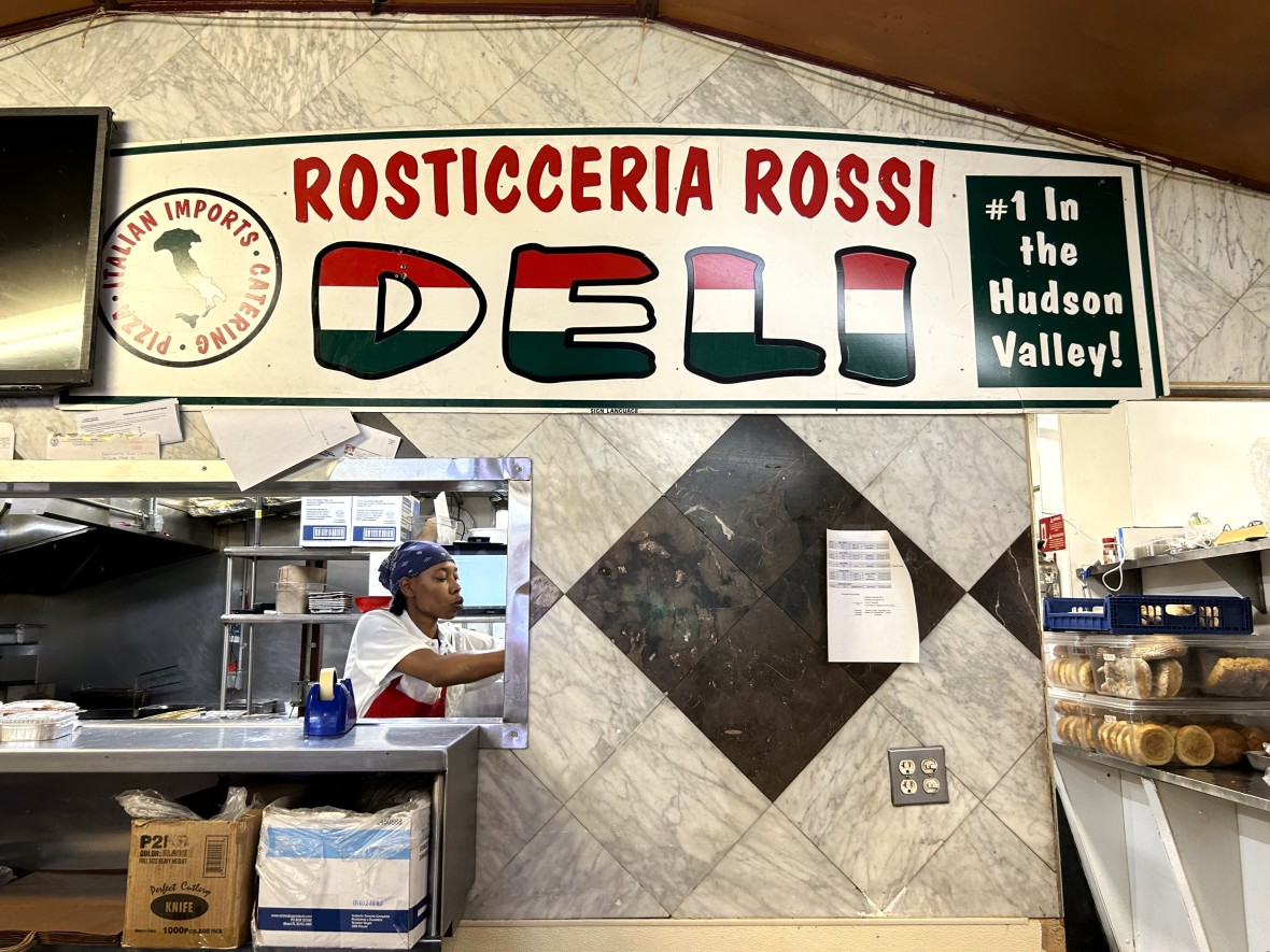 Rosticerria Rossi & Sons interior with banner