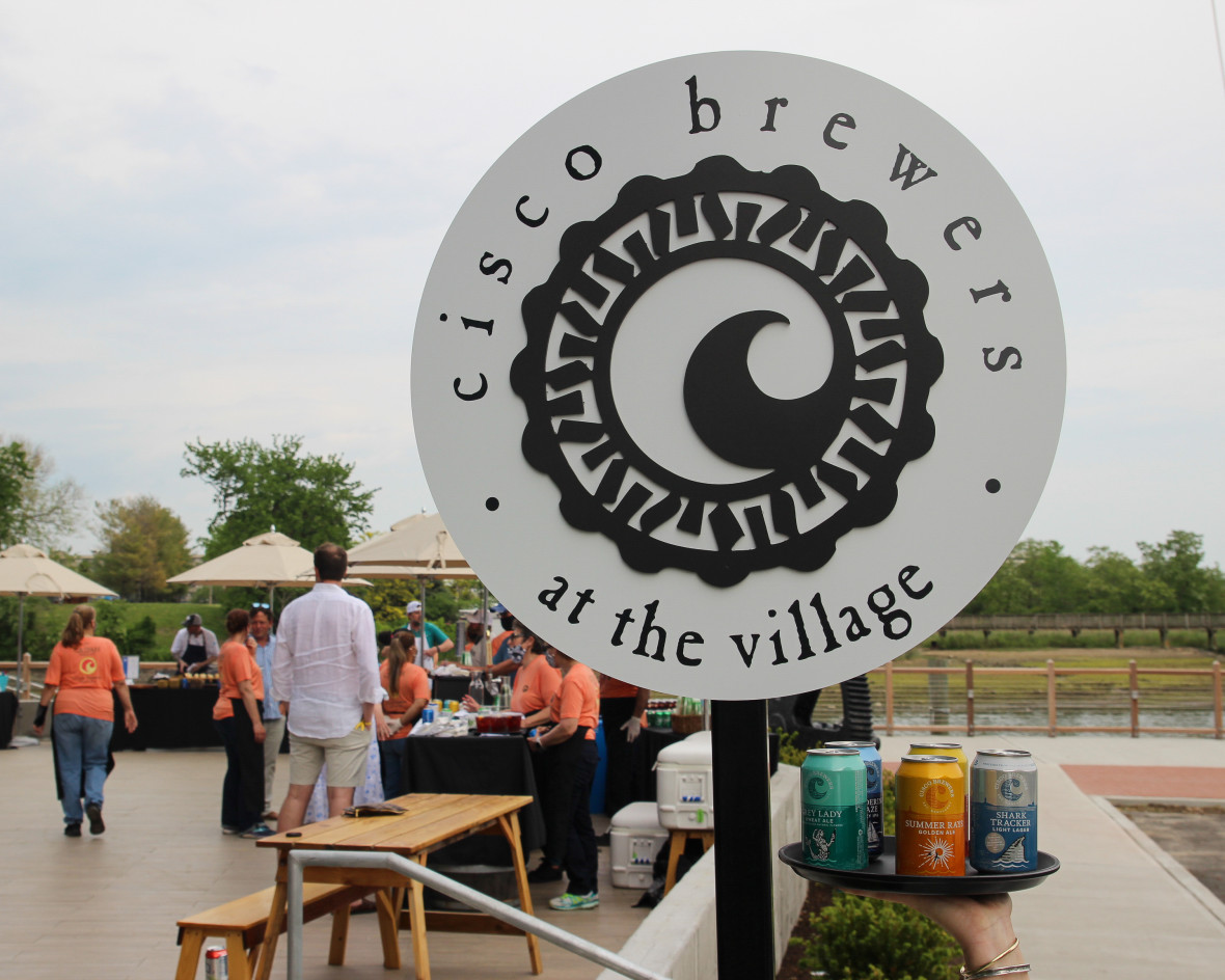 A Cisco Brewers sign welcoming patrons to outdoor beer garden