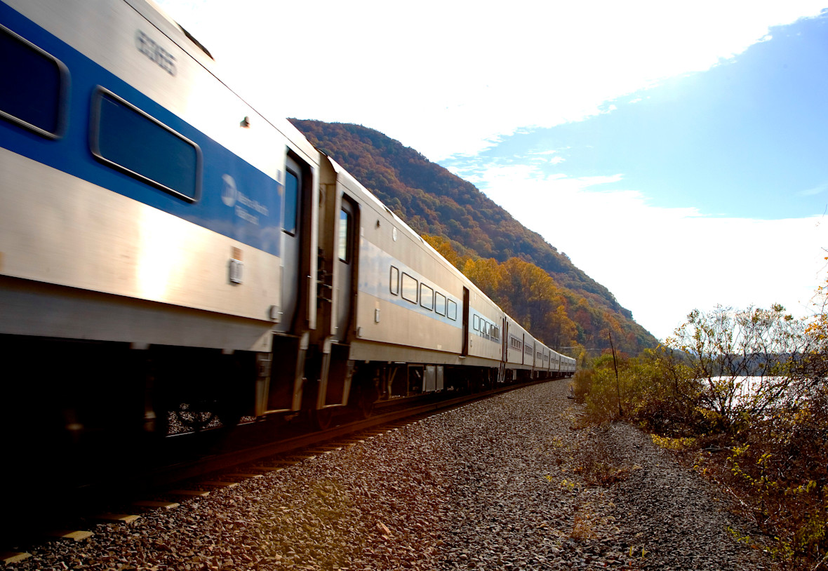Metro-North train traveling on tracks alongside the Hudson River
