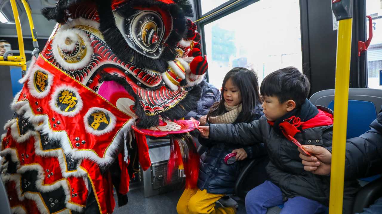 Lunar New Year lion dancer bus