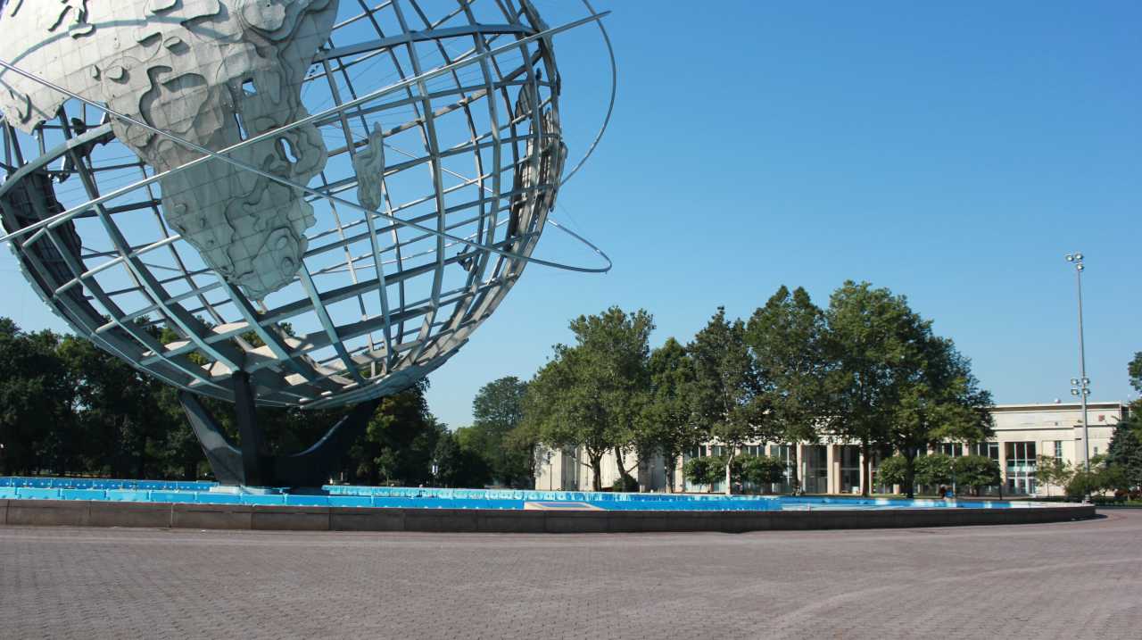 The Unisphere with Queens Museum in background in Flushing