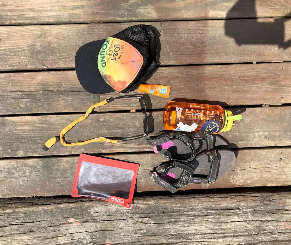 Water shoes, water bottle, waterproof phone case and more kayaking essentials