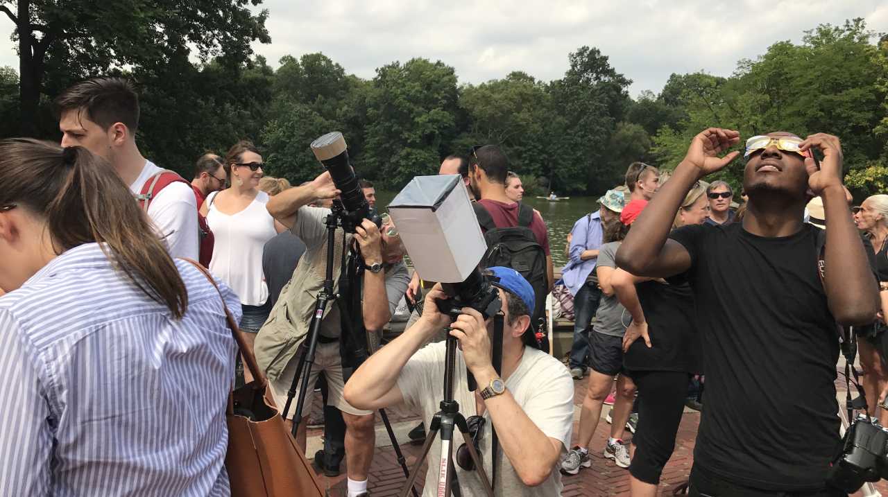 People observing the 2017 solar eclipse in Central Park