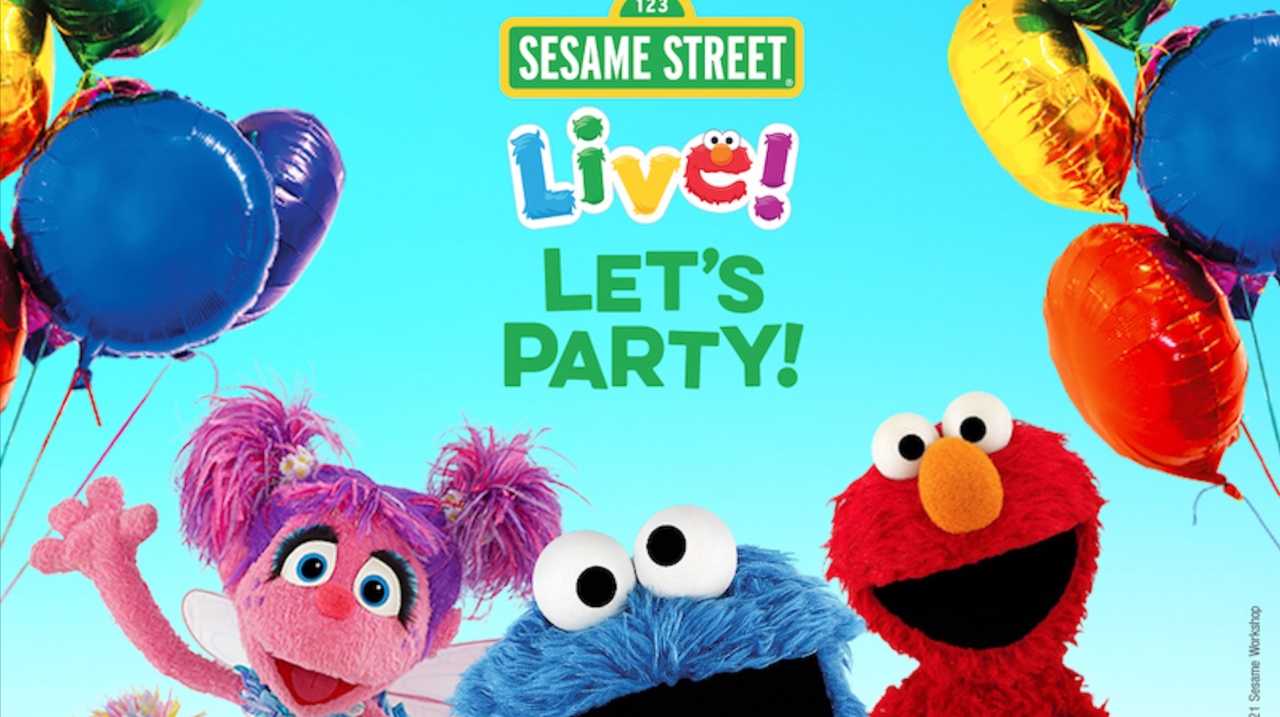 Abby, Cookie Monster and Elmo celebrating 'Sesame Street Live! Let's Party' with balloons