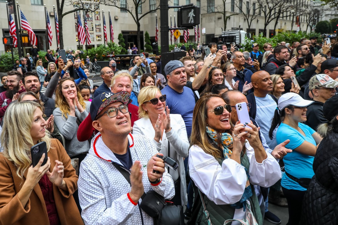 A crowd watches the 82-foot-tall Norway Spruce arrive on November 12th 