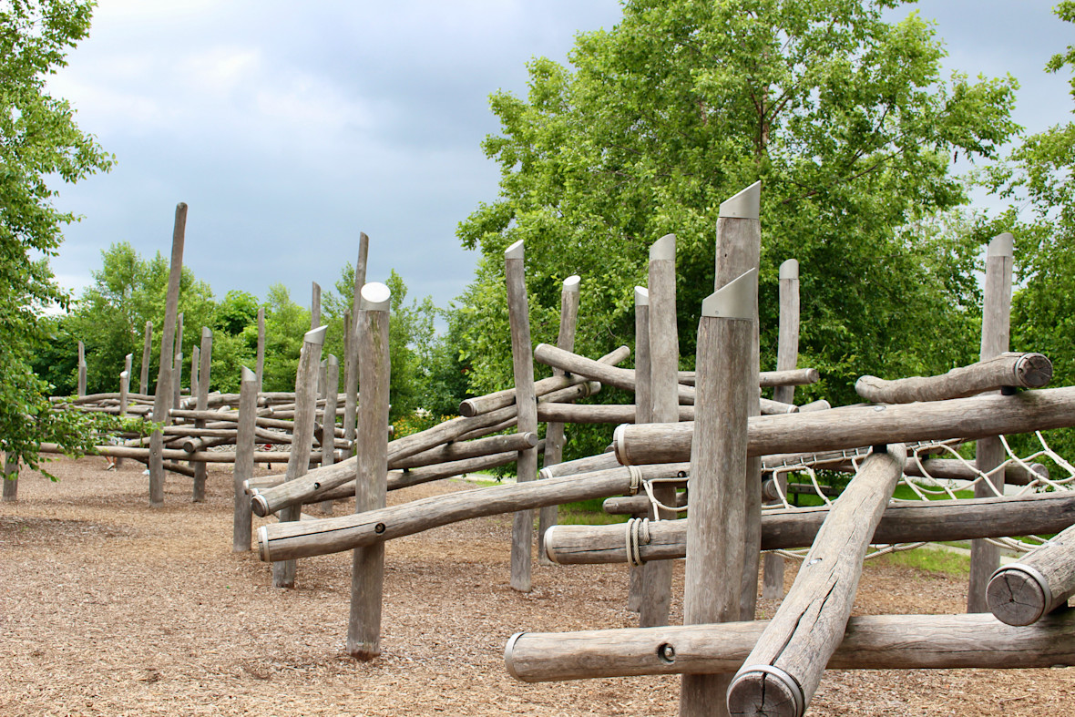 Wood climbing structures at Hammock Grove Play Area