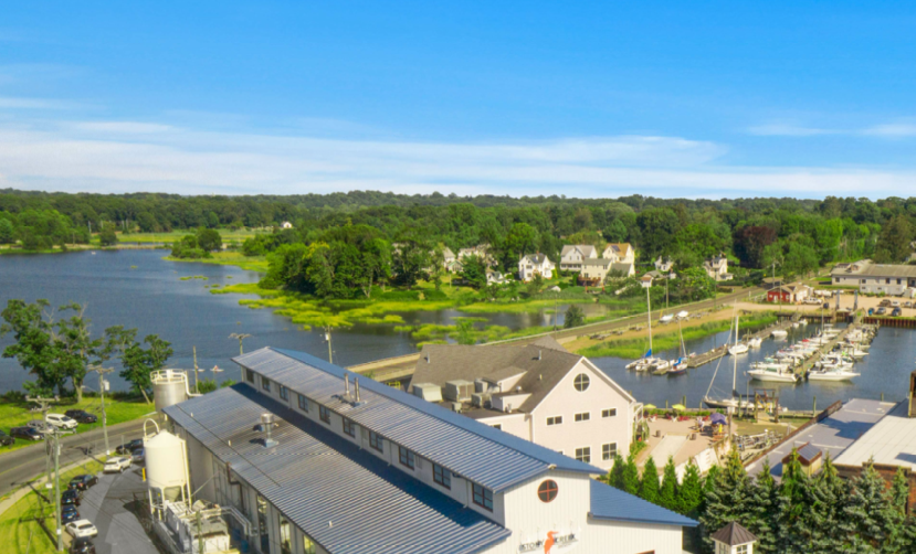 Overhead view of sprawling Stony Creek Brewery on a riverbank