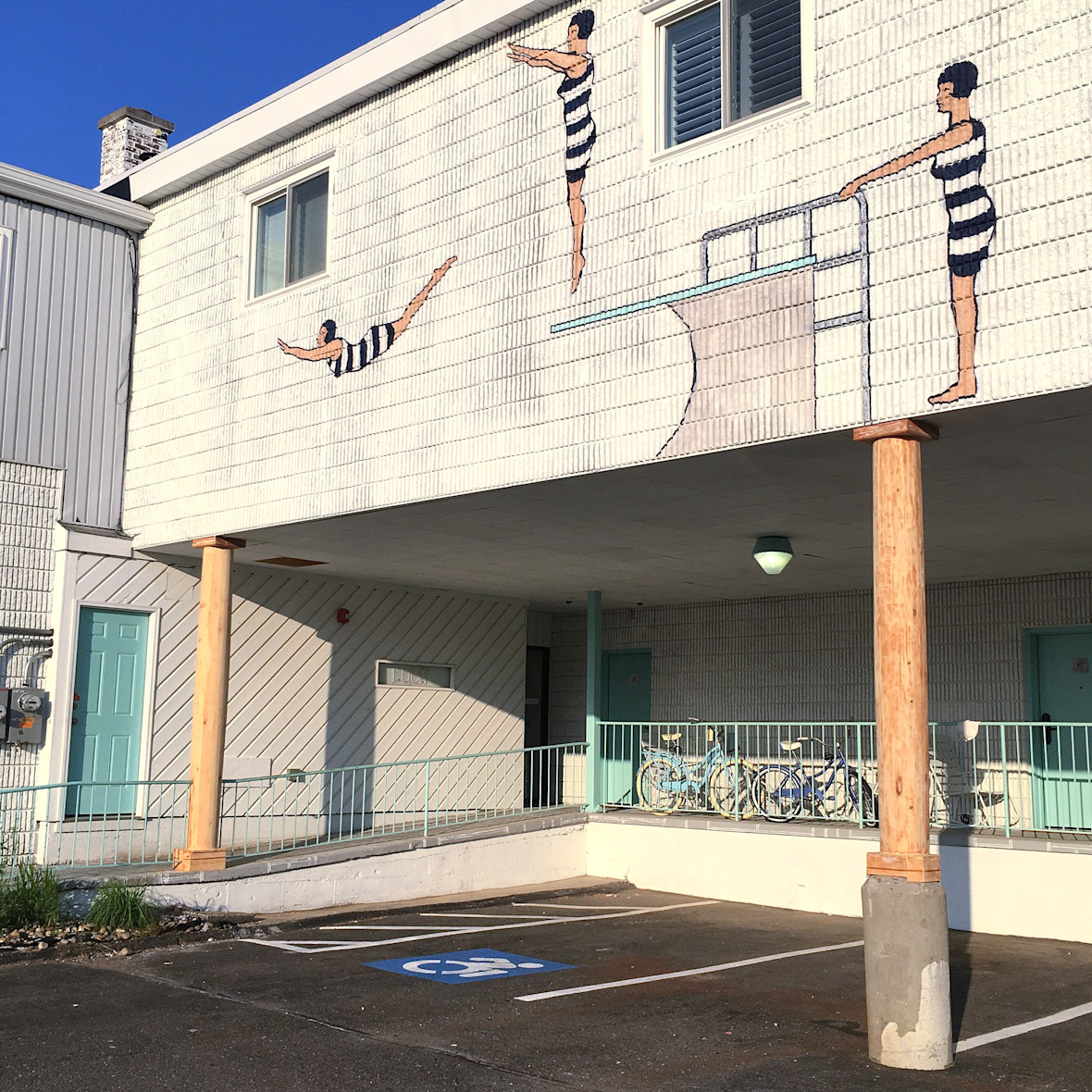 Mural of swimmers on side of Surfside Hotel