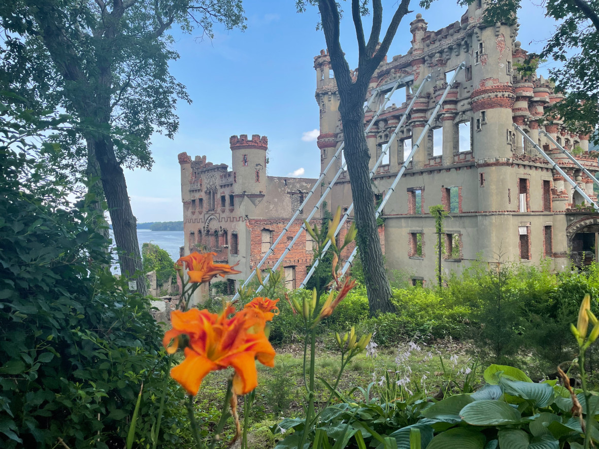 A view of Bannerman Castle with lilies in foreground