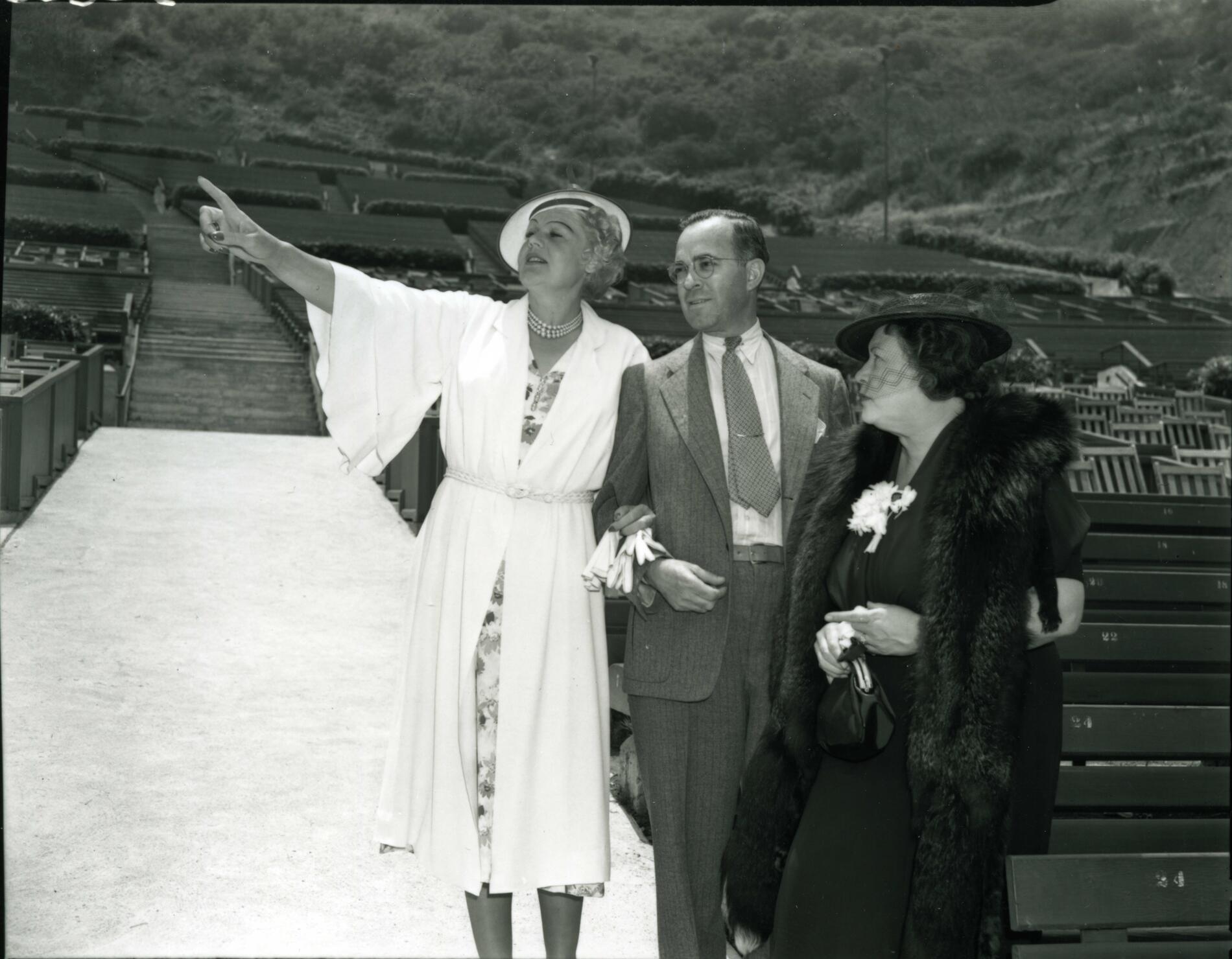 L-R, Maria Jeritza, unidentified man, and Mrs. Florence M. Irish overlooking the Hollywood Bowl, 1938.