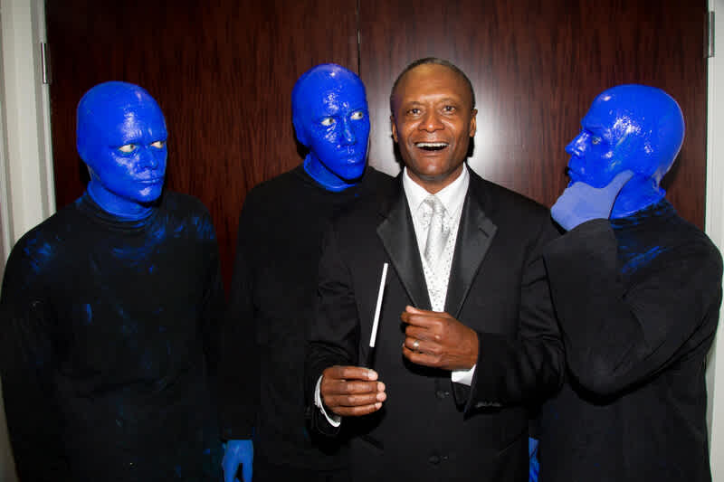 Bowl Principal Conductor Thomas Wilkins poses with the Blue Man Group before their concert in 2013