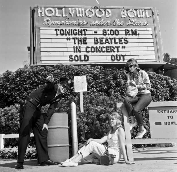 Police and music fans out front of the Bowl before their concert at the height of Beatlemania.