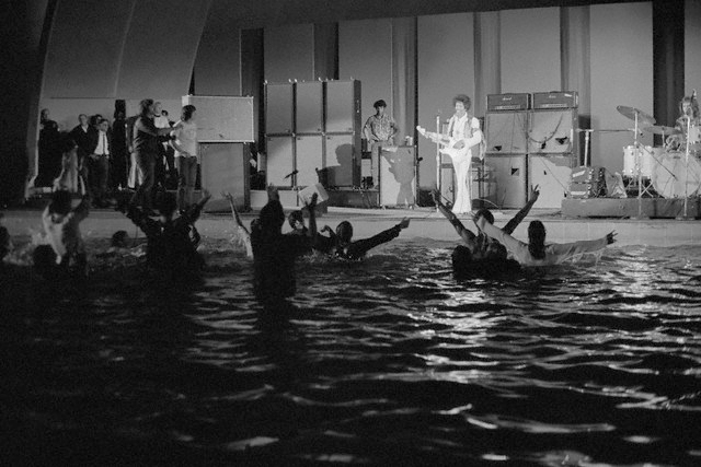 Fans jump into the pool circle