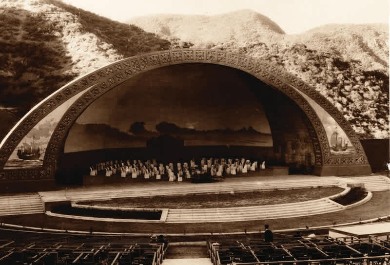 The first Hollywood Bowl shell–designed by the Allied Architects in 1926 depicted naval scenes and Eastern imagery
