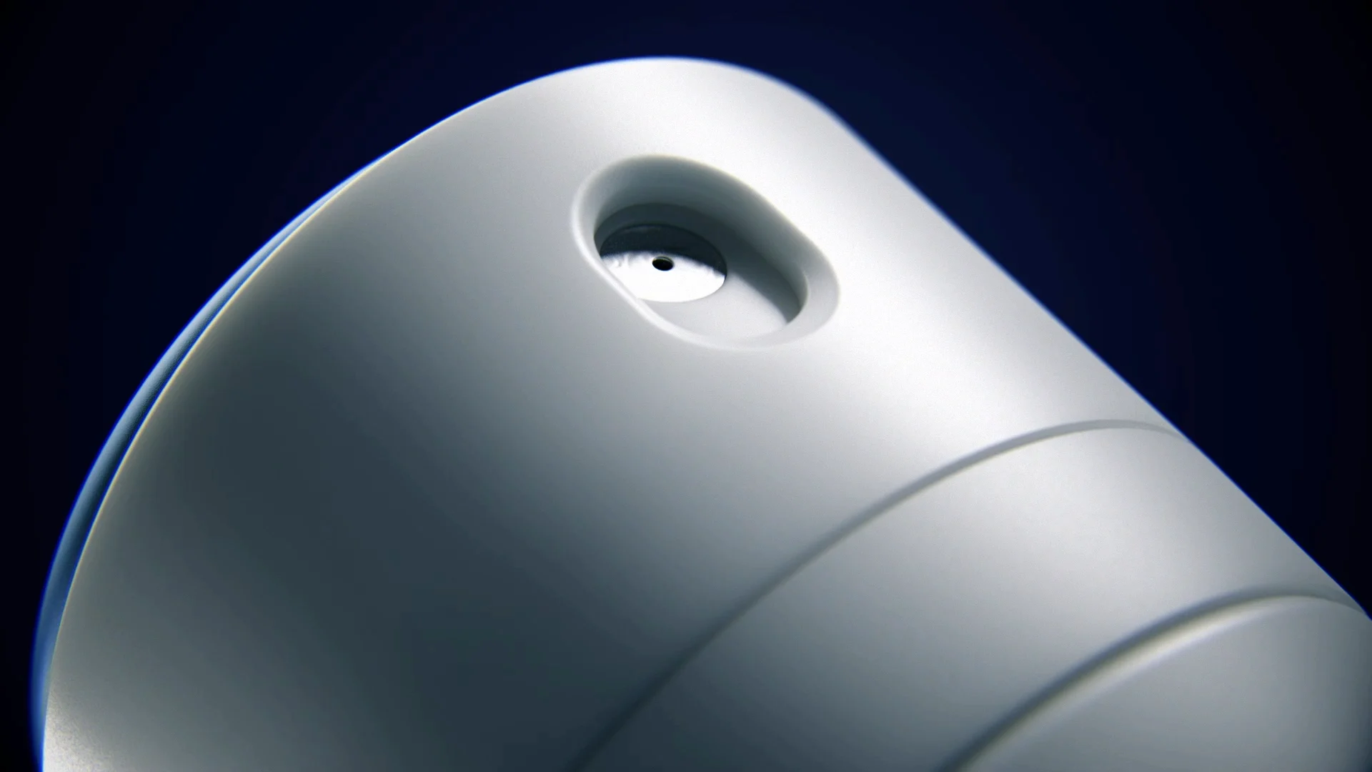 close up of the head of an aerosol packshot with a blue pusher and a white surface