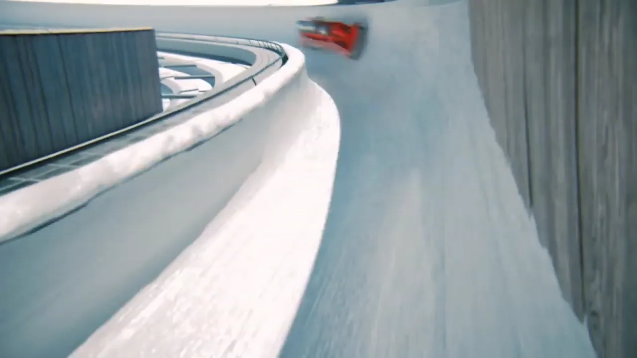 a red bobsleigh with two drivers in it speeding down a bobrun