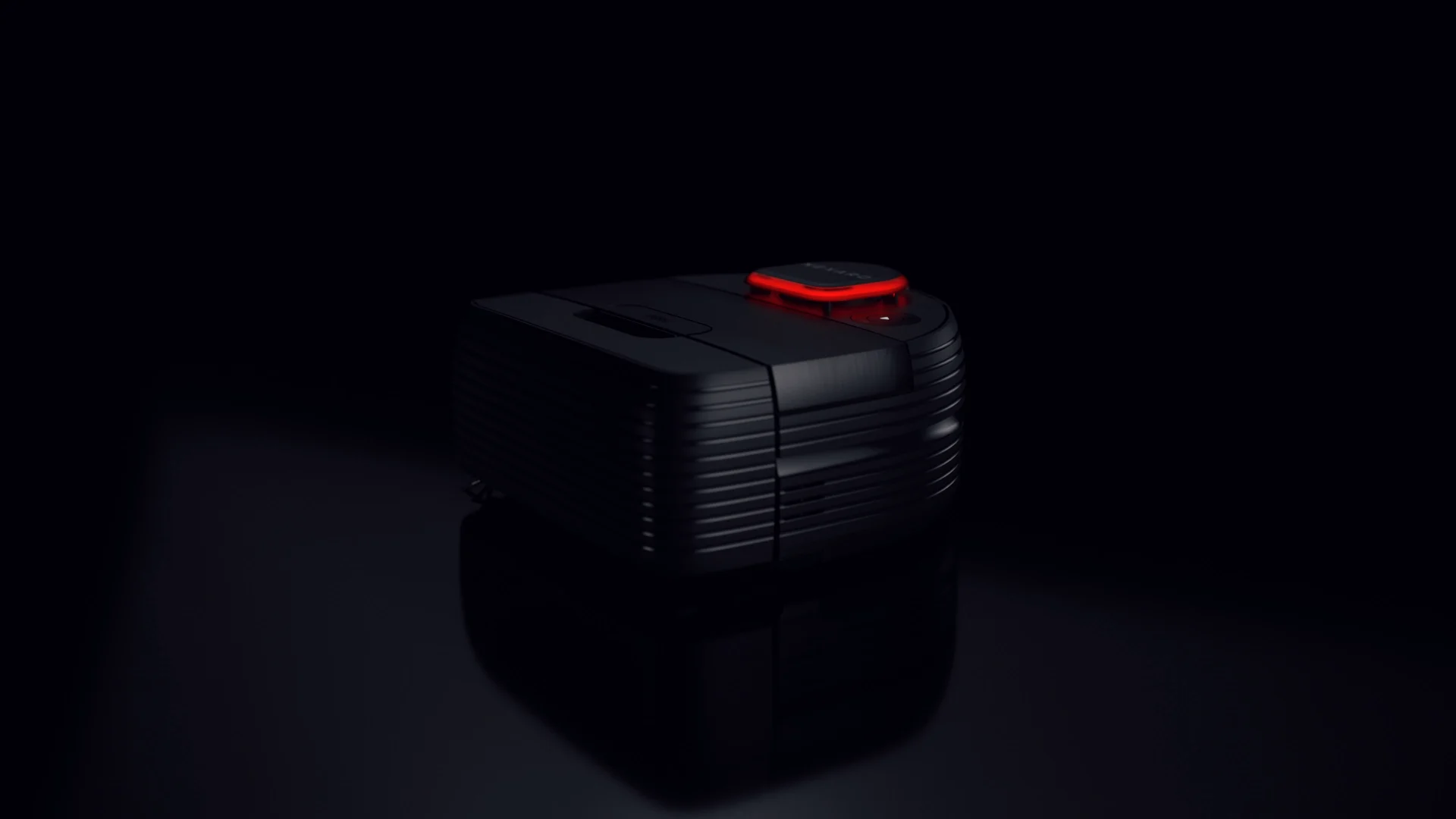 a black nexaro vacuum cleaner robot in an undefined black room