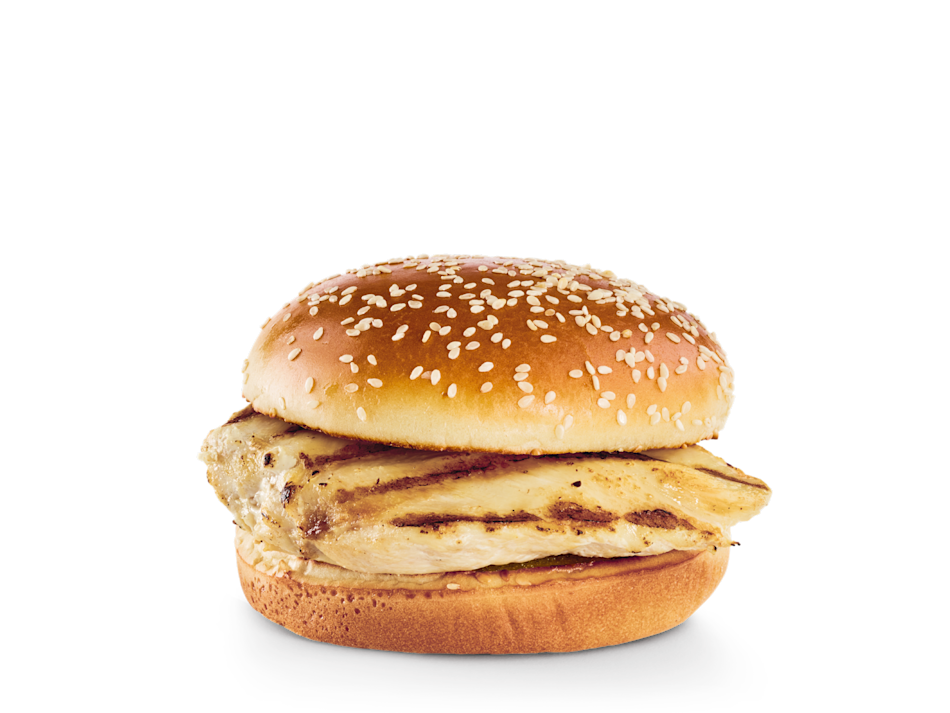 Pickles, lettuce, tomatoes and red onions on the side.