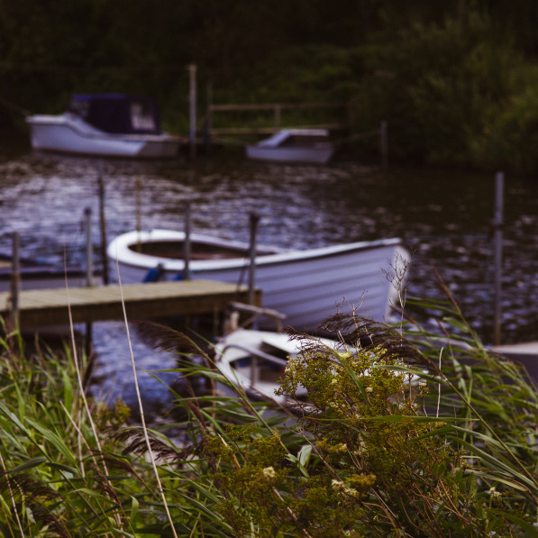 Little boats in the stream and wild nature