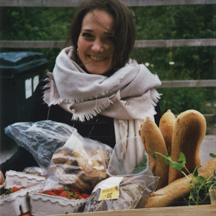 Iben from food reformers holds a basket full of food