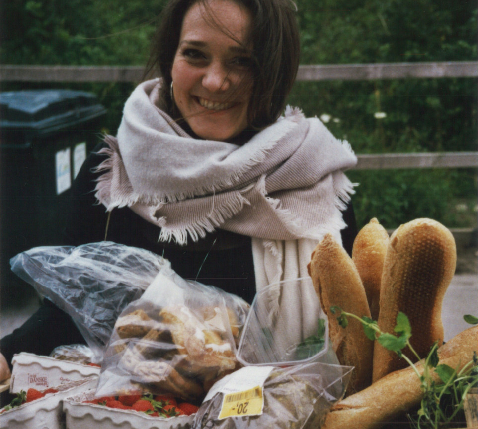 Iben from food reformers holds a basket full of food