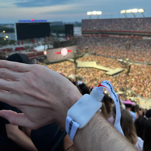 My arm wearing a light-up bracelet, taken just before Night 3 of Taylor Swift's Eras Tour in Tampa, FL.
