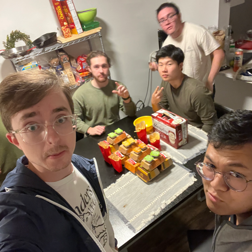 Me, my partner, and roommates participating in our semesterly tradition of using coupons to buy ridiculous amounts of food from McDonald's.