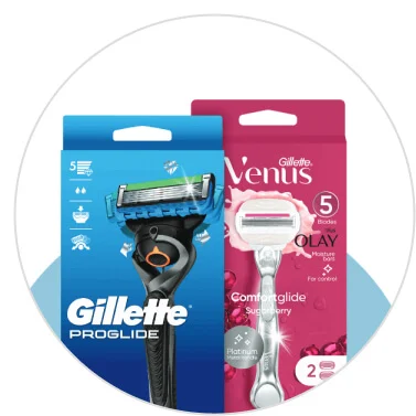 A blue box of Gillette packaging and a pink box of Venus packaging.  