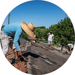 Workers repairing a roof
