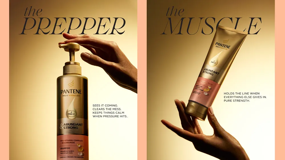 Shows a hand pumping a shampoo bottle labeled "the PREPPER" and another hand holding a conditioner tube labeled "the MUSCLE", both on a golden background