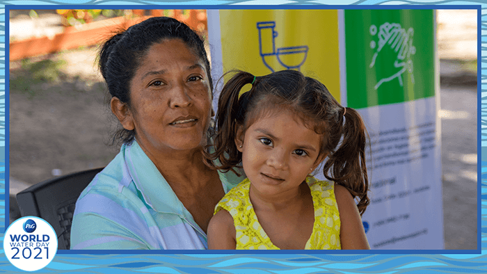 Leda is seated with her granddaughter Mahia after Hurricane Eta impacted their community in Honduras in November 2020.