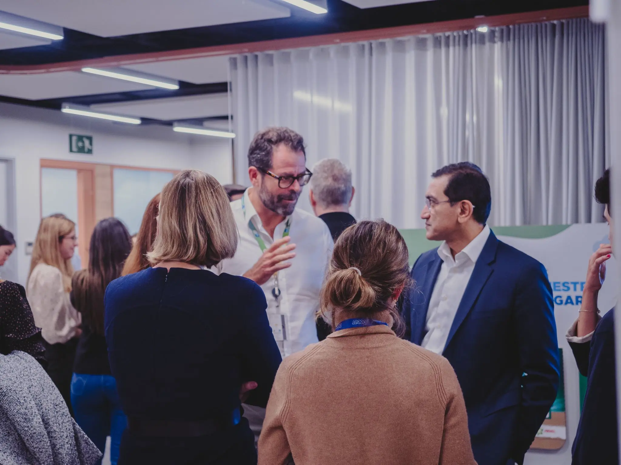 Shailesh Jejurikar, P&G’s Chief Operating Officer & P&G Spain employees talking in the office.