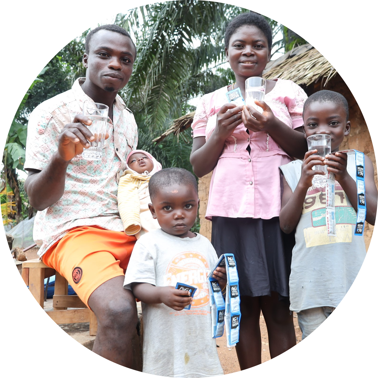Family holding P&G purified water and purifying packets