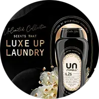 Downy Unstopables scent booster bottle with black label and floral graphics on a dark background
