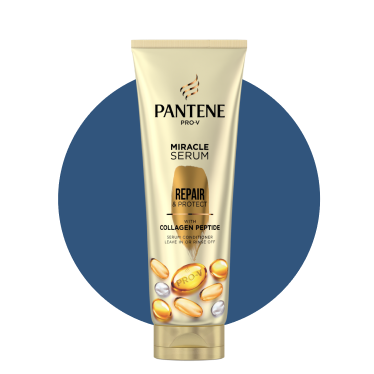 A light gold bottle of Pantene with gold capsule.