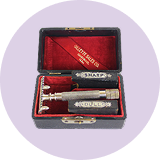 Early Gillette razor set displayed inside a hard presentation case
