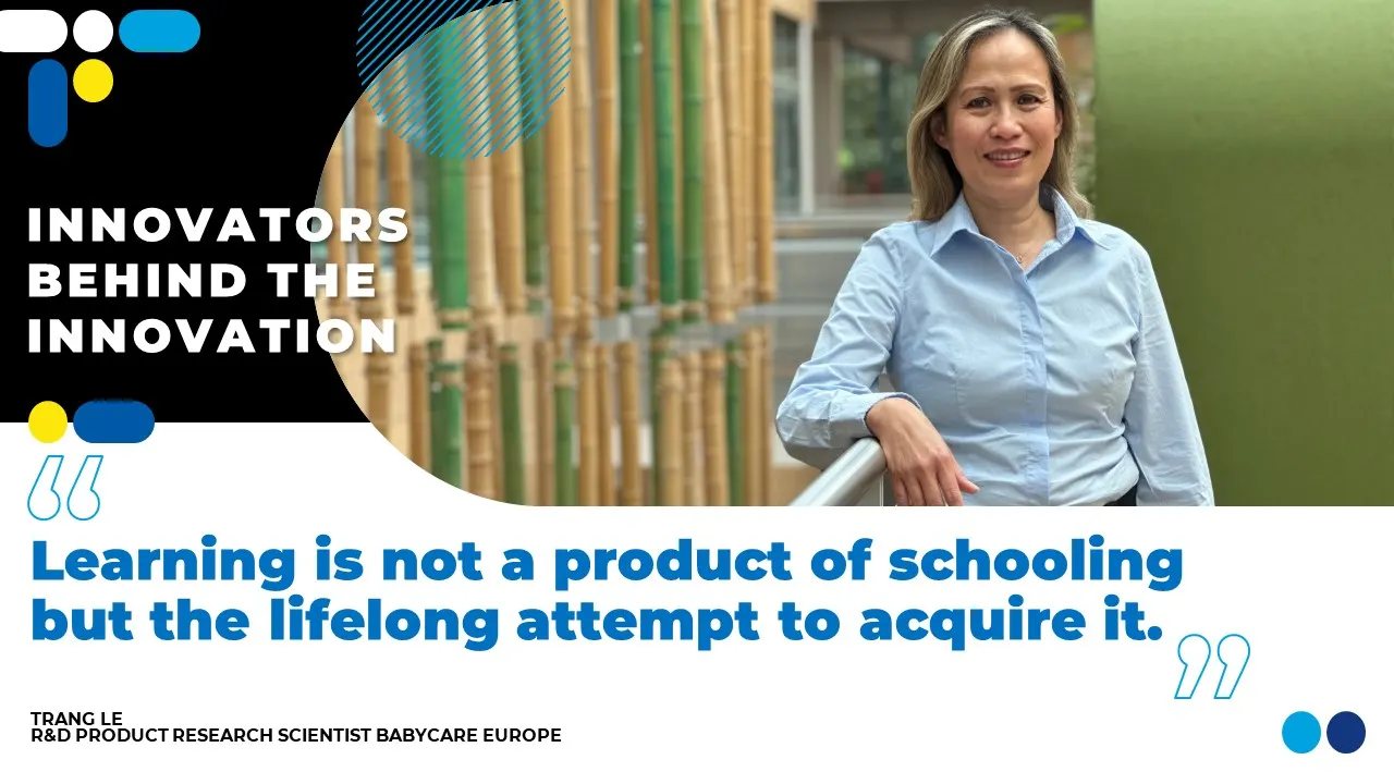 An Asian woman with shoulder length blonde hair in a light blue collared shirt. 